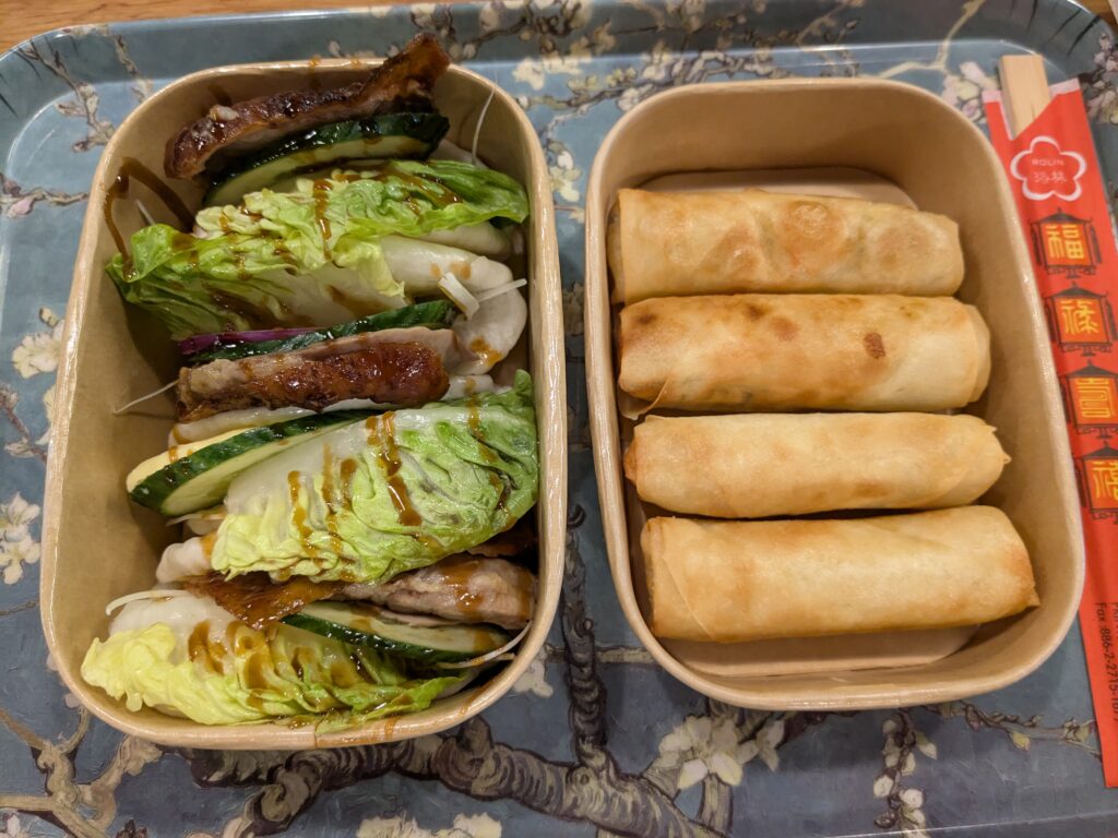 Peking duck buns on the left, vegetable spring rolls on the right.